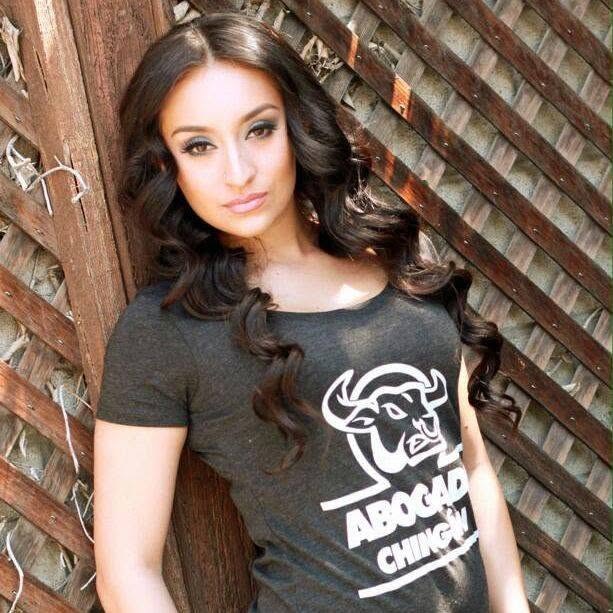 Model in a black Abogado Chingón tee